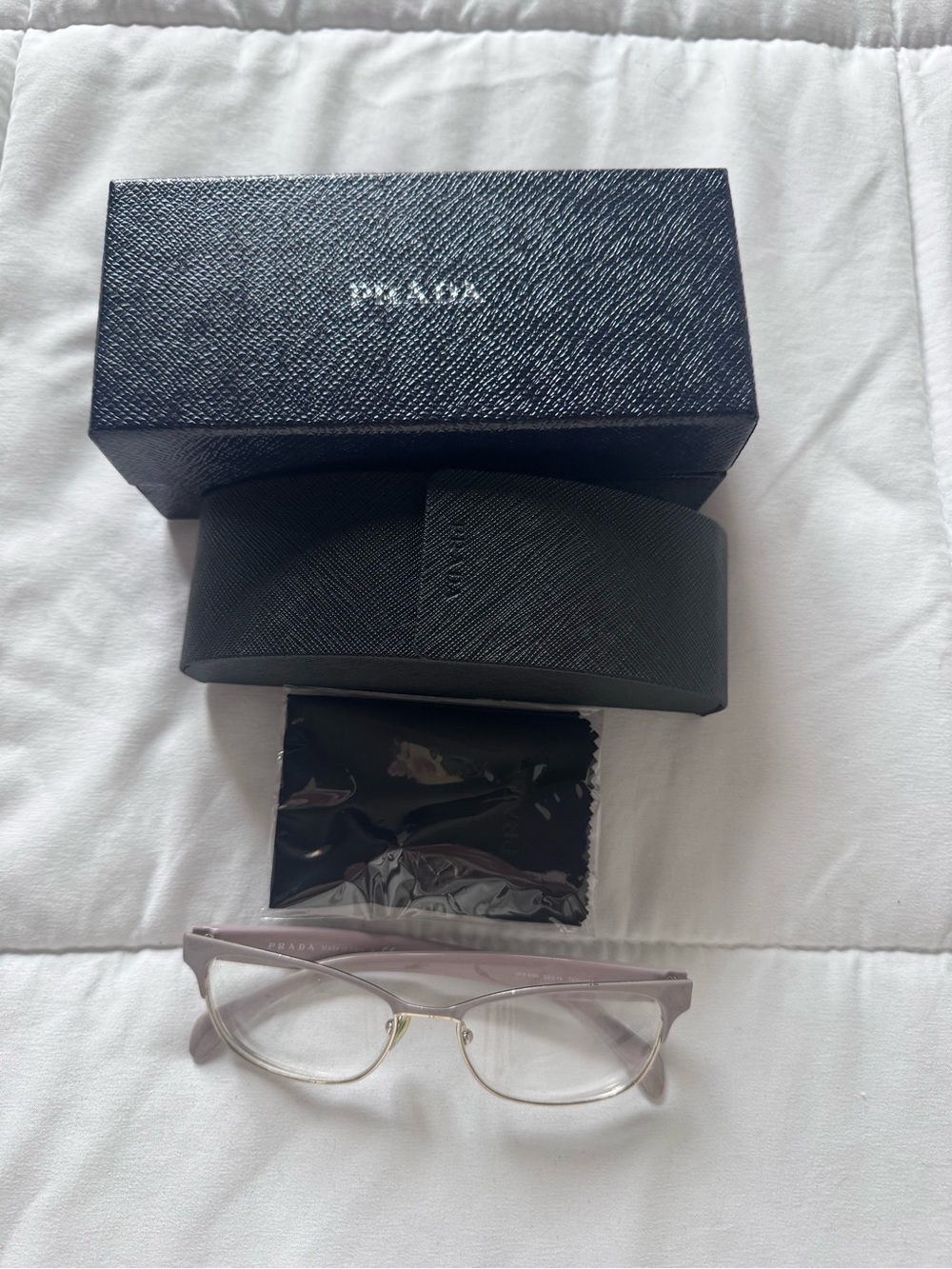 Prada Translucent Light Purple Eyeglasses with Gold Accents and Black Case